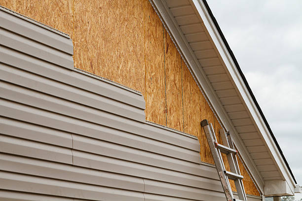Professional Storm Damage Siding Repair technician working in Dauphin, PA
